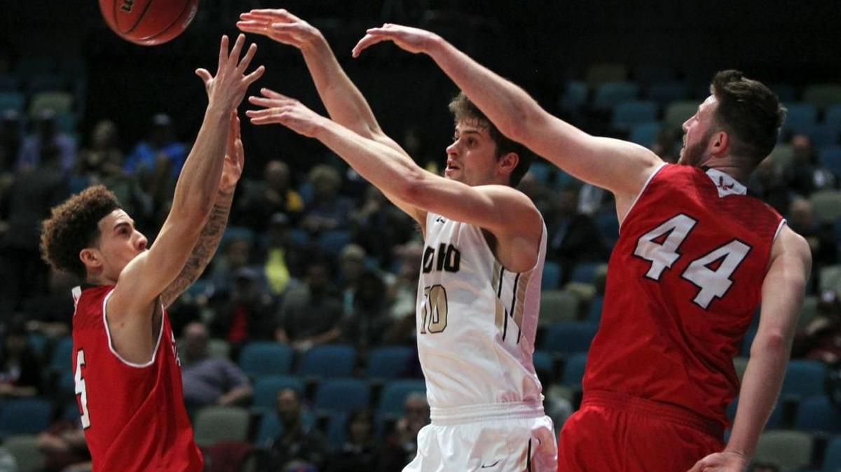 Idaho Vandals guard Chris Sarbaugh (10) passes as Eastern Washington guard Austin McBroon (5) and forward Felix Von Hofe (44) defend during the second half of their Big Sky Conference tournament quarterfinal Thursday in Reno, Nev.