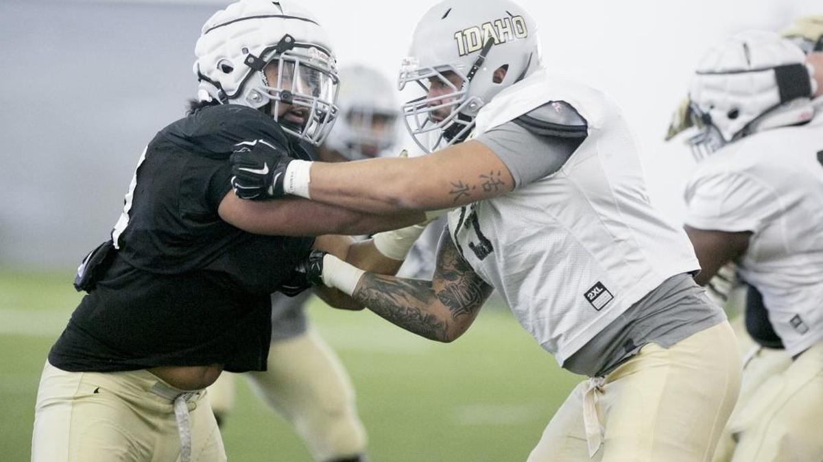 University of Idaho football player Tueni Lupeamanu (left, 44) tries to fight through a block during practice at the Caven-Williams Sports Complex in preparation for the Idaho Potato Bowl on Thursday. Monday December, 19, 2016.