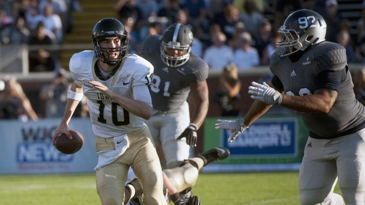 Georgia Southern defensive lineman Jonathan Battle puts pressure on University of Idaho quarterback Matt Linehan in Statesboro, Ga.