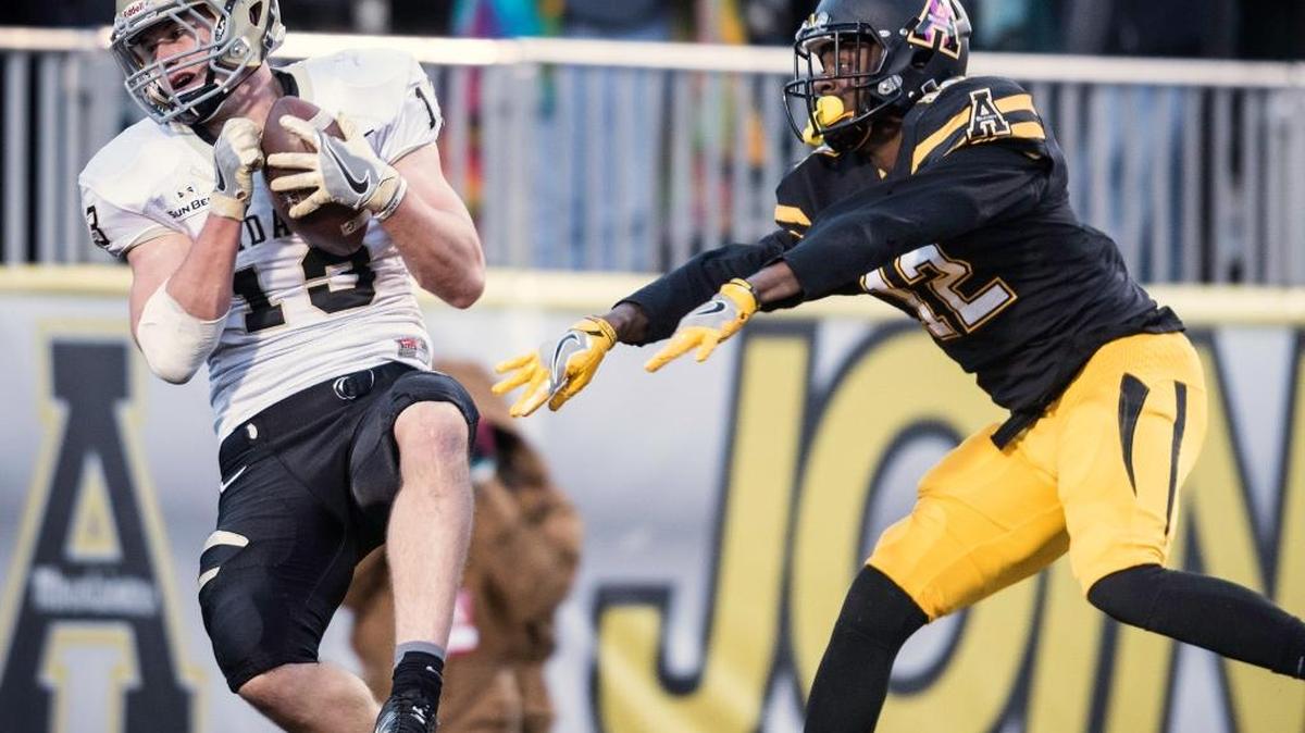 Idaho tight end Trent Cowan (13) catches a pass over Appalachian State defensive back Brandon Pinckey (12) for a touchdown during an NCAA college football game Saturday, Oct. 22, 2016, in Boone, N.C.