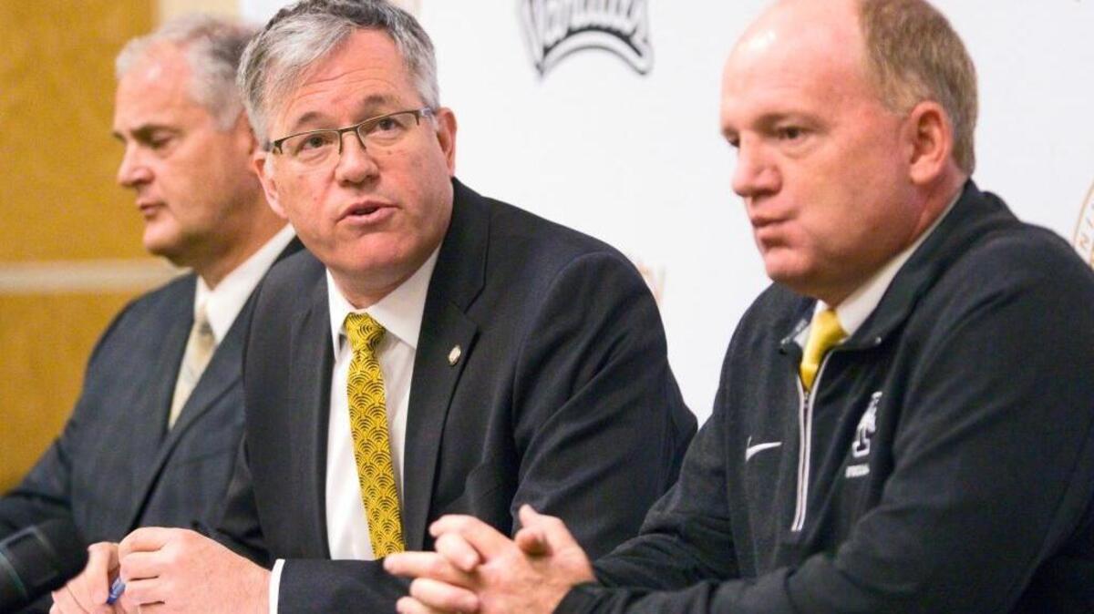 University of Idaho President Chuck Staben, center, Athletic Director Rob Spear, left, and head football coach Paul Petrino answer questions during a news conference Thursday, April 28, 2016, at the Kibbie Dome in Moscow. Idaho will drop to the Football Championship Subdivision beginning in 2018 and intends to join the Big Sky Conference, school President Chuck Staben said.