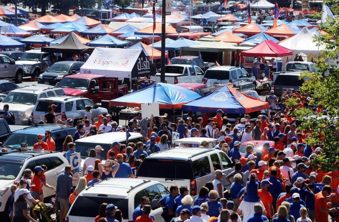 Boise State fans tailgate before the UT Martin game in the parking lot of Bronco Stadium in 2013.