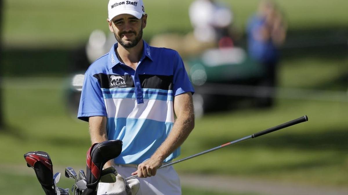 Troy Merritt cleans his club during the practice round of the Bridgestone Invitational golf tournament at Firestone Country Club in 2015.