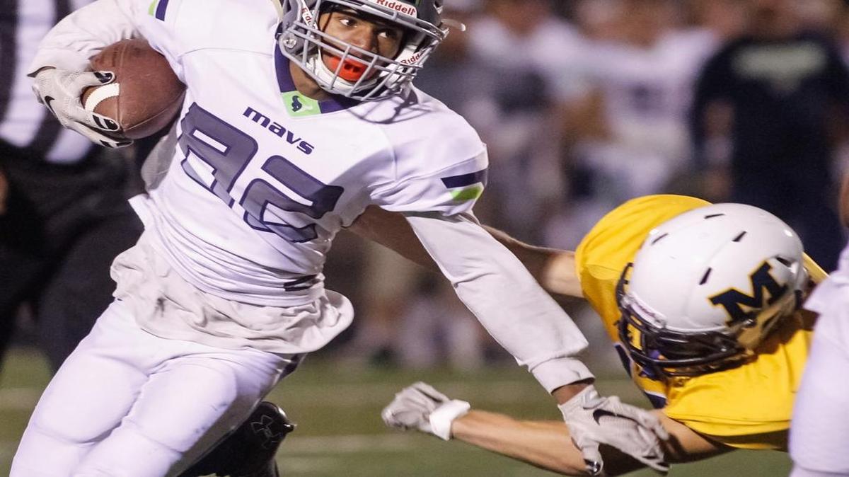 Mountain View’s Jamell Peyton evades a Meridian defender during their game Friday night at Meridian High.
