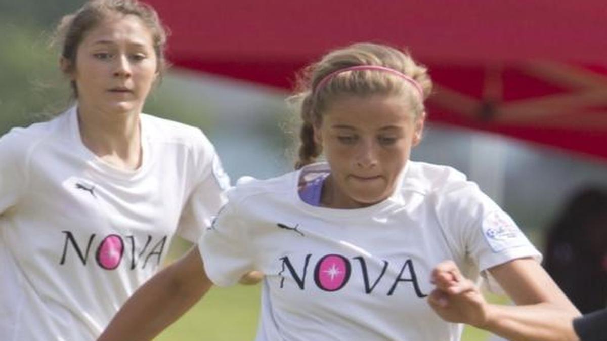 Madison Carter (Timberline High) carries the ball upfield for FC Nova last summer during the Far West Regional semifinals at Simplot Sports Complex.