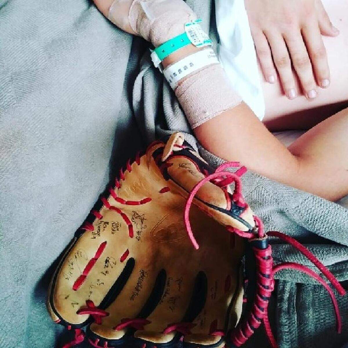 The Payette High baseball team signed and returned Kodee Bennett's glove to him Saturday at Saint Alphonsus.