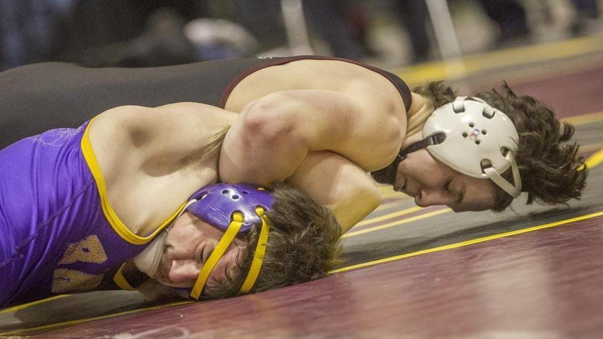 Jaron Chavez (top) won three individual state championships during his wrestling career at Centennial.
