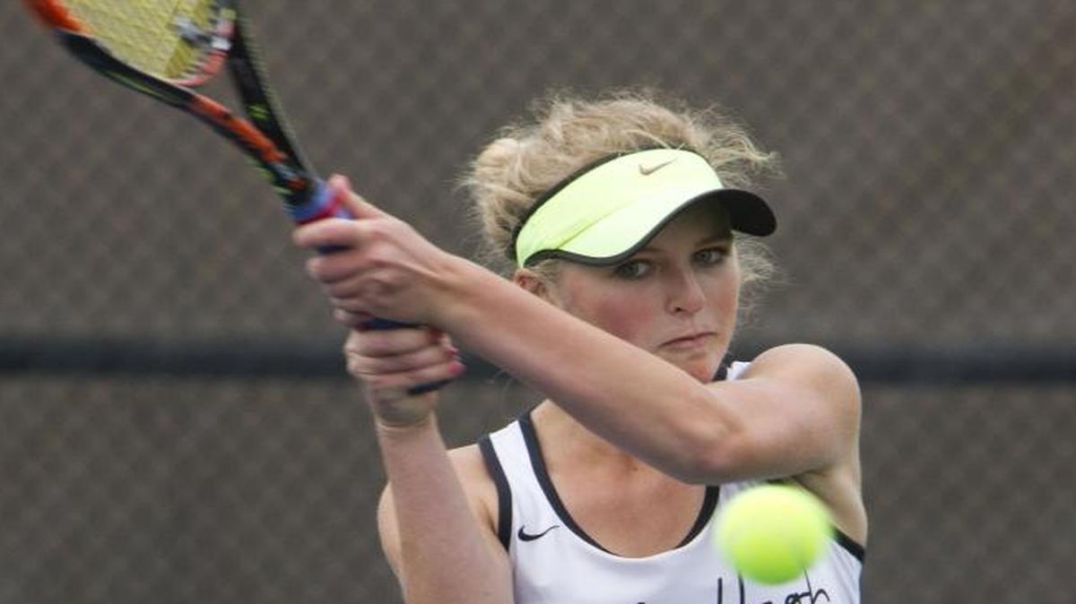 Skylar Schossberger, right, returns a shot at the state tournament last year as doubles partner Amelia Cogan looks on. Schossberger and Cogan won the doubles title, but Schossberger makes the move to singles this season.