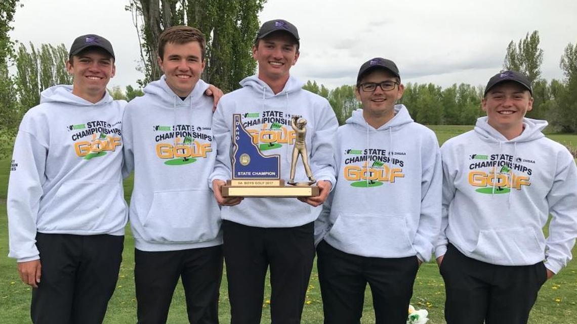 From left, Rocky Mountain golfers Carson Barry, Drew Reinke, Ranger Downs, Sam Tidd and Jake Slocum celebrate their 5A state tournament victory Tuesday at Teton Lakes Golf Course in Rexburg.