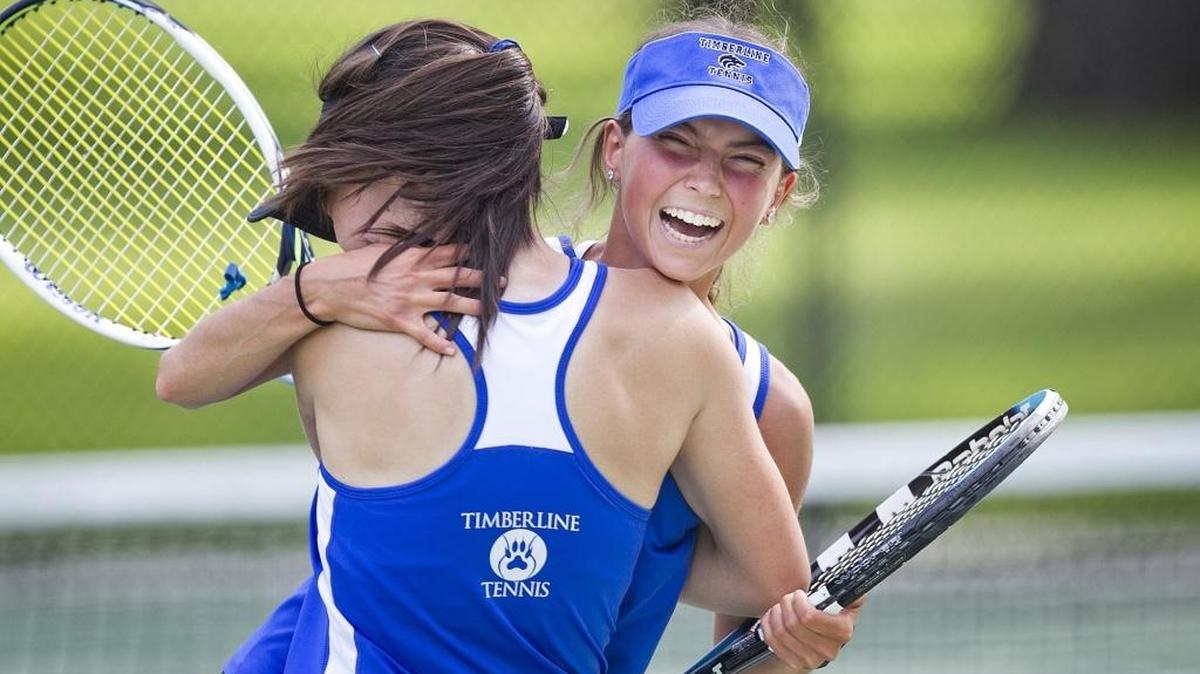 Timberline’s Claudia Dominguez, right, and Devon Austin-Canning celebrate their 6-1, 6-3 5A district girls doubles championship over Kiana and Lysandra Zamudio from Columbia High School at Boise’s Julia Davis Park on Friday.