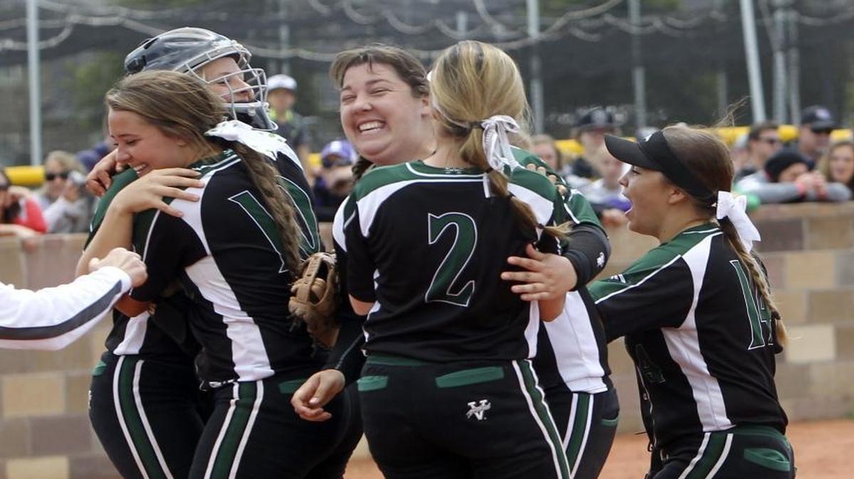 Eagle players celebrate beating Rocky Mountain to win the 5A softball tournament championship at Mountain View High in Meridian on May 22, 2016.