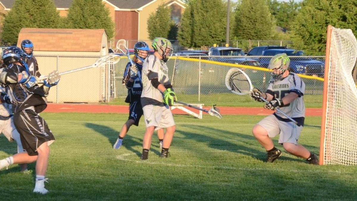 Timberline sophomore Nathaniel Taylor, left, scores just before halftime in the Wolves’ 10-3 victory over Mountain View in the Idaho High School Lacrosse League Division I championship game Wednesday at Maverick Stadium in Meridian.