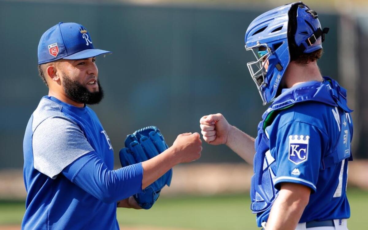 Former College of Southern Idaho catcher Parker Morin talks with Royals pitcher Kelvin Herrera during a spring training workout Feb. 17.