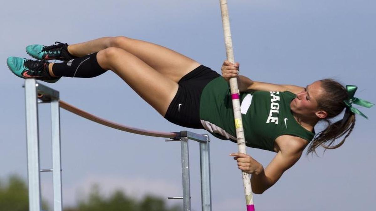 Eagle’s McKenna Dustin clears the bar in the girls pole vault at the 5A District Three track and field meet May 13 at Meridian High.