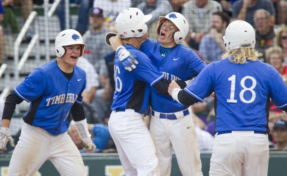 TImberline’s Connor Riddle celebrates a two-run triple during last year’s 5A state championship game. He’s one of eight returning starters for the Wolves.