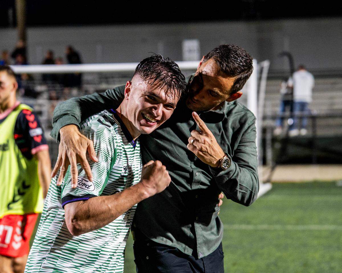 Denys Kostyshyn, left, celebrates his game-winning goal with AC Boise coach Nate Miller after a 1-0 win the club’s debut game over the Sarasota Paradise on Saturday in Lakewood Ranch, Florida.