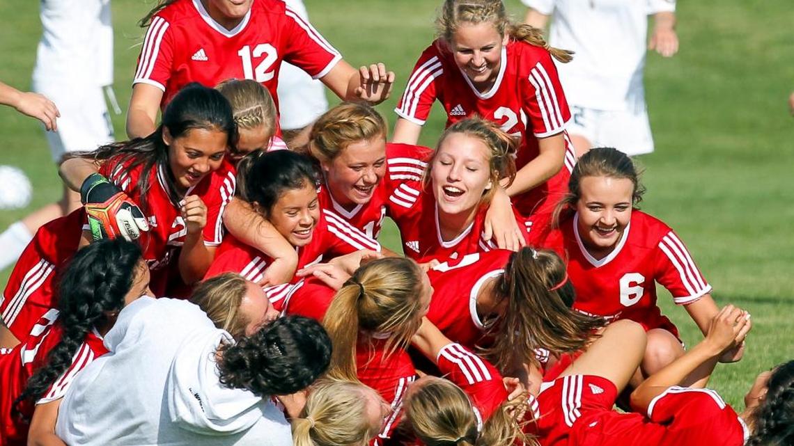 The Weiser girls soccer team celebrates winning the 3A state championship over Coeur d’Alene Charter on Saturday at Middleton High.