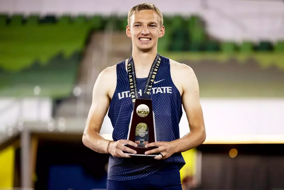 Columbia High grad Logan Hammer poses with the trophy after finishing second in the men’s pole vault at the NCAA track and field championships last week in Eugene, Oregon.