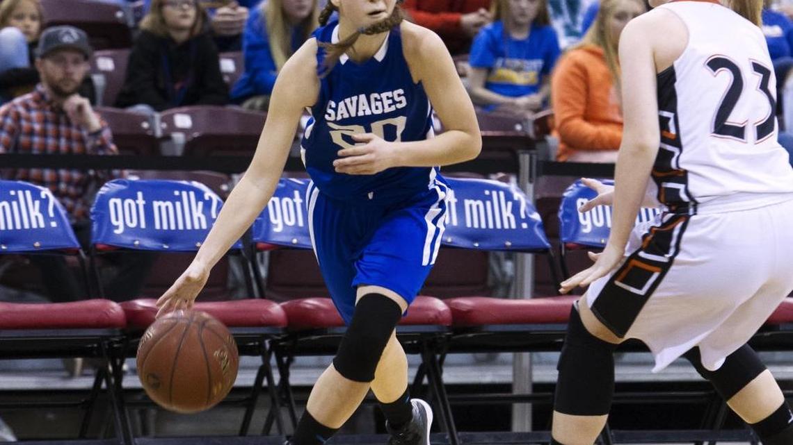 Salmon River guard Chevelle Shepherd drives to the baseline defended by Butte County’s Macy Hansen during the 1A Division II girls basketball state championship game Saturday at the Ford Idaho Center in Nampa.