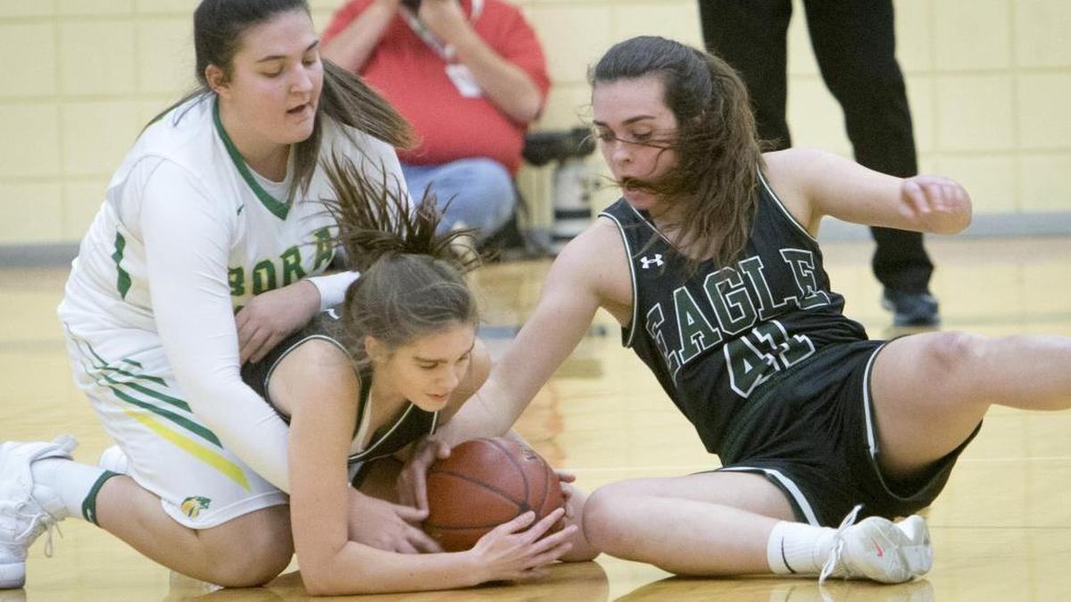 Eagle’s Gabi Peters, right, battles for a loose ball at Borah on Jan. 12.
