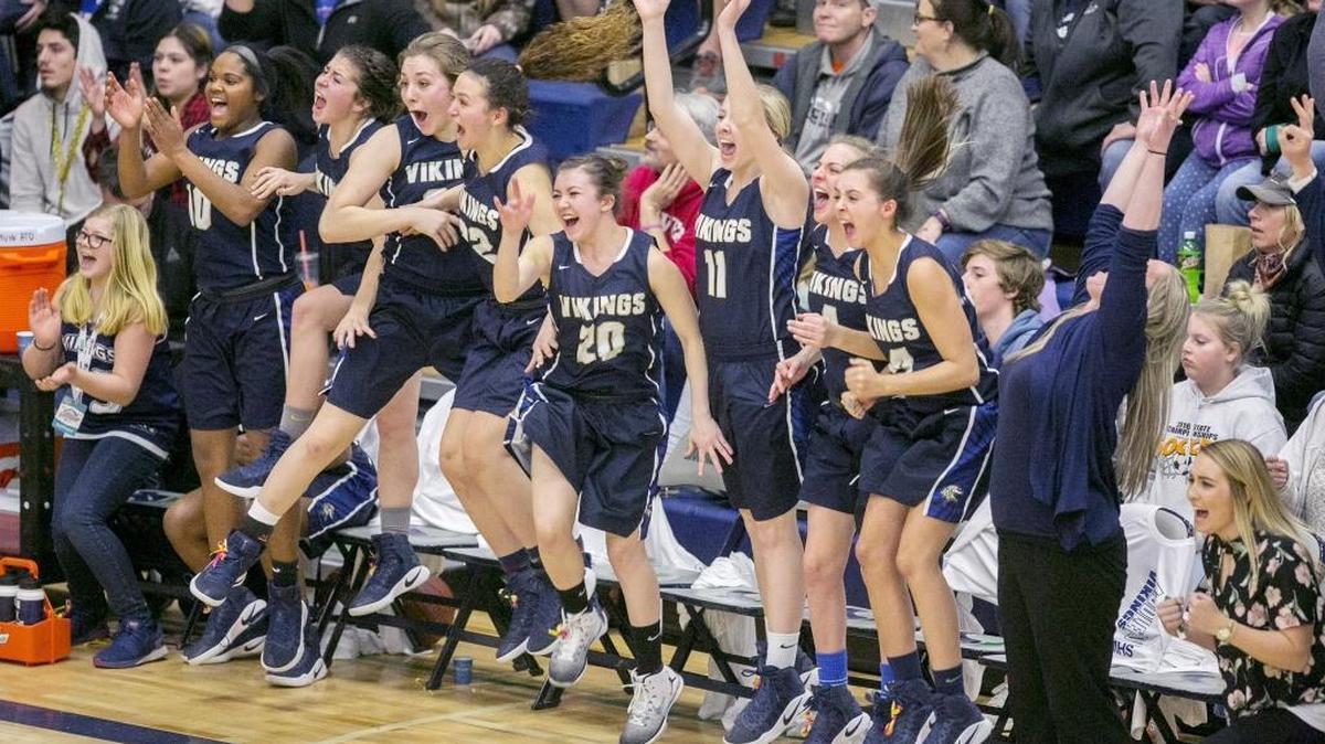 Middleton players celebrate a go-ahead basket late in the fourth quarter that gave the Vikings their first lead of the game during Friday’s 4A state semifinals against Preston at Mountain View High. Middleton defeated Preston 56-55.
