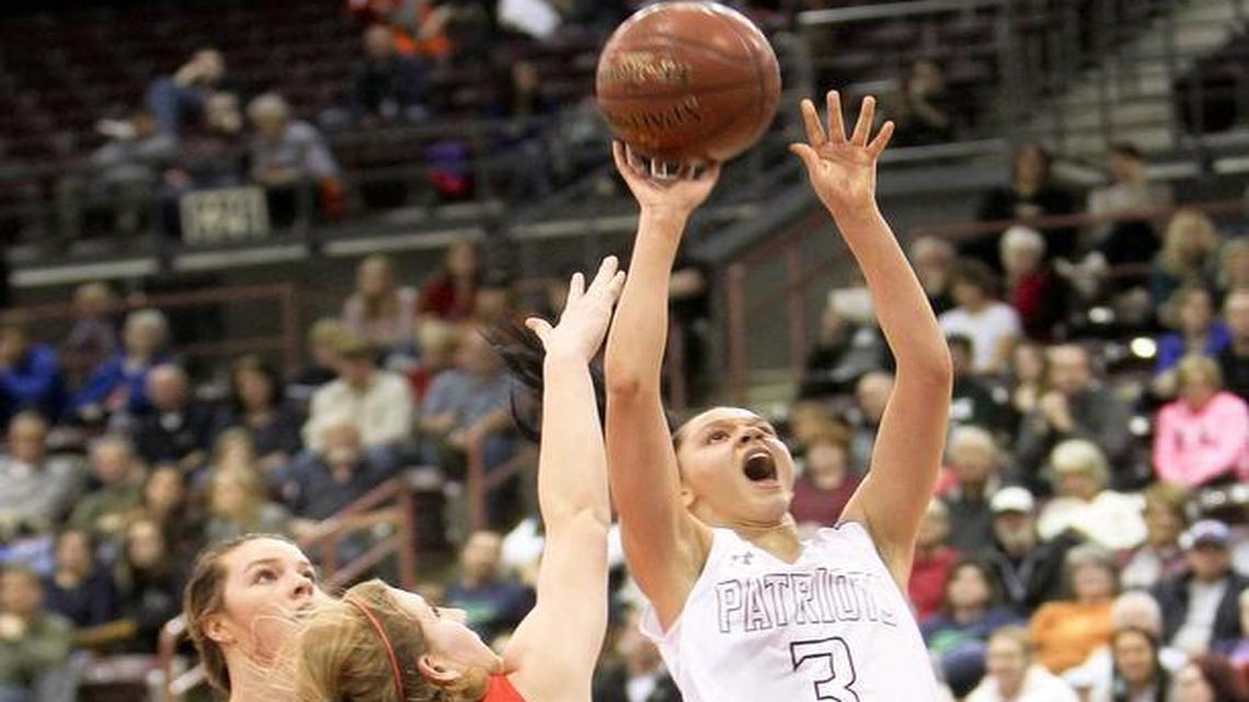 Centennial High’s Tori Williams shoots over the defense of Boise’s Audrey Dingel during the 5A girls state basketball semifinals at the Ford Idaho Center on Feb. 19.