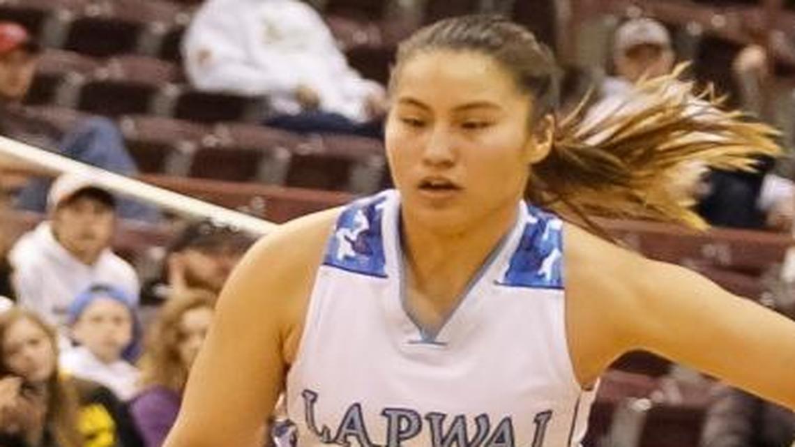 Lapwai’s Iris Domebo drives past Prairie’s Krystin Ulenkott during the second half of the 1A Division I state championship Feb. 21 at the Ford Idaho Center.