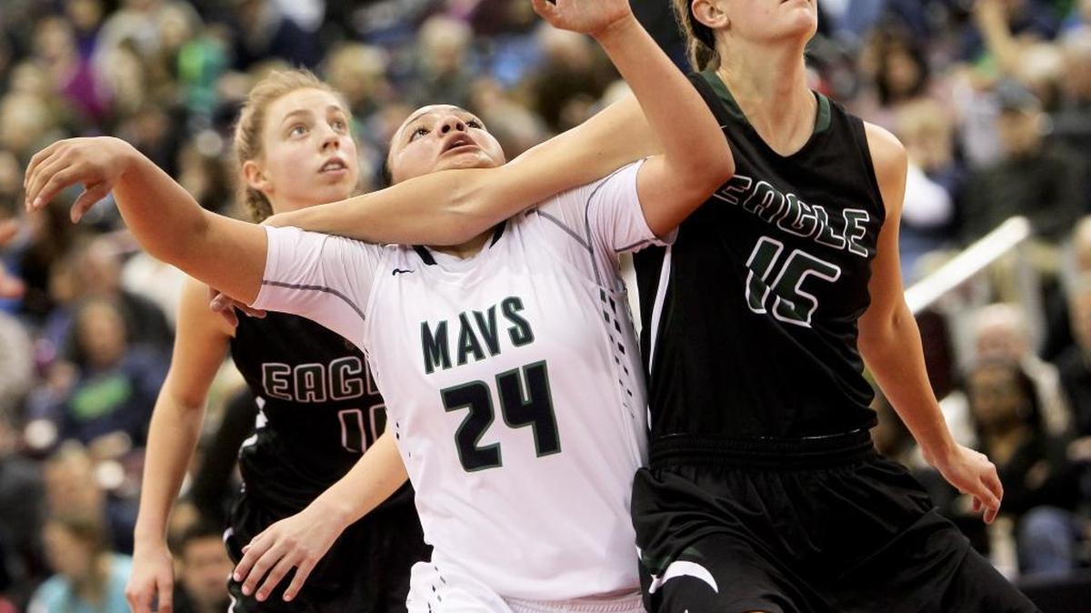 Mountain View High School player Destiny Slocum (24) fight for rebounding position with Eagle High School player Jenny Stevens (15) during the the 5A girls basketball semifinal at the Ford Idaho Center in Nampa, Idaho. Mountain View defeated Eagle 72-52. Eagle player Janie King (back, 11) is also pictured. Friday February 19, 2016.