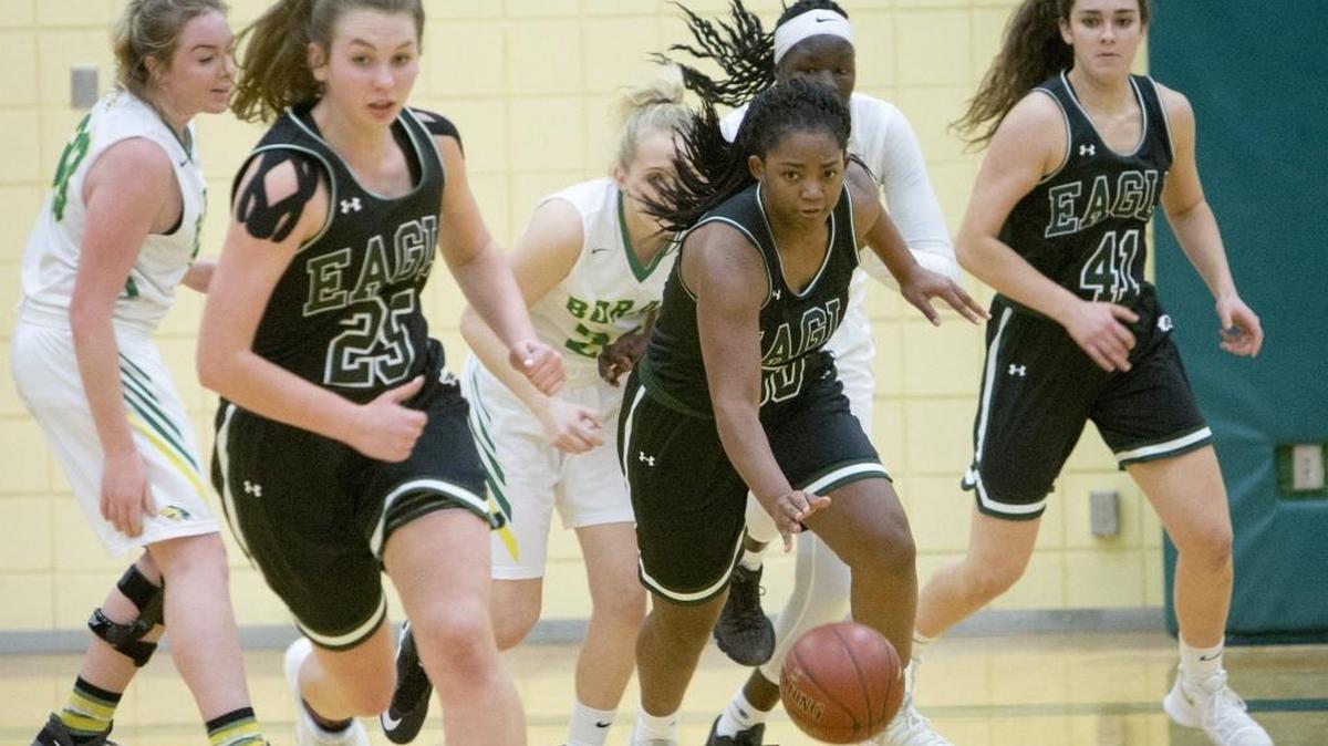 Jamiee McKinnie leads the Eagle fastbreak with Dana Murray, left, and Gabi Peters, right, during a 51-15 victory at Borah on Friday. The undefeated and No. 1-ranked Mustangs triggered the running clock mercy rule to start the fourth quarter against No. 3 Borah.