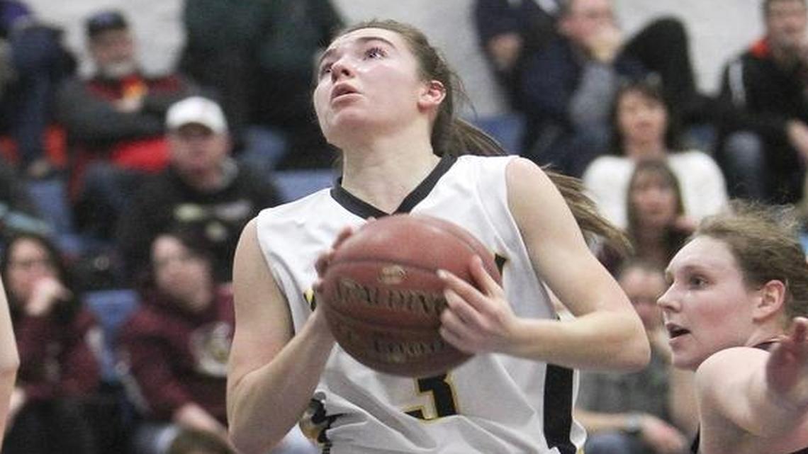 Bishop Kelly’s drives and scores over Rigby’s defense in the first round of the 4A state tournament Feb. 18 at Timberline High.