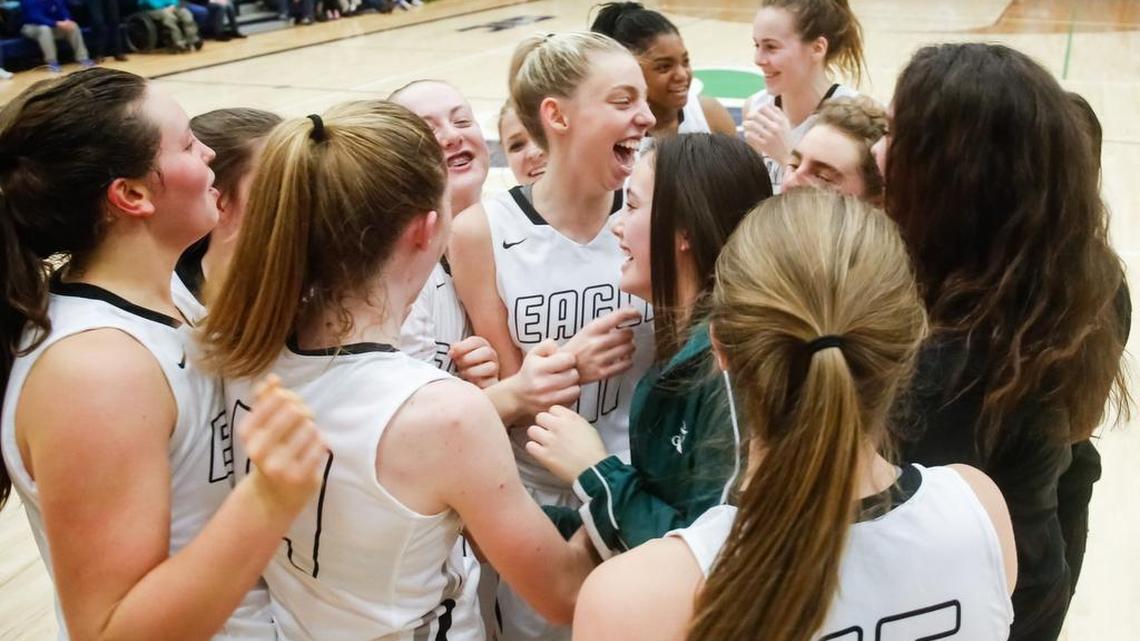 Eagle’s Janie King, center, and her teammates celebrate a 65-52 victory over Centennial in the 5A District Three Tournament title game at Mountain View High in Meridian on Friday. The state tournament starts next week.