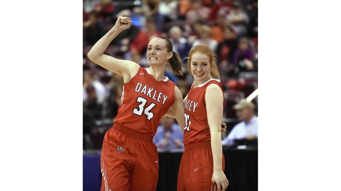 Oakley’s Rachael Mitton, left, and Liz Hardy celebrate their win against Prairie in the 1A-DI state championship game Feb. 17 at the Ford Idaho Center in Nampa.