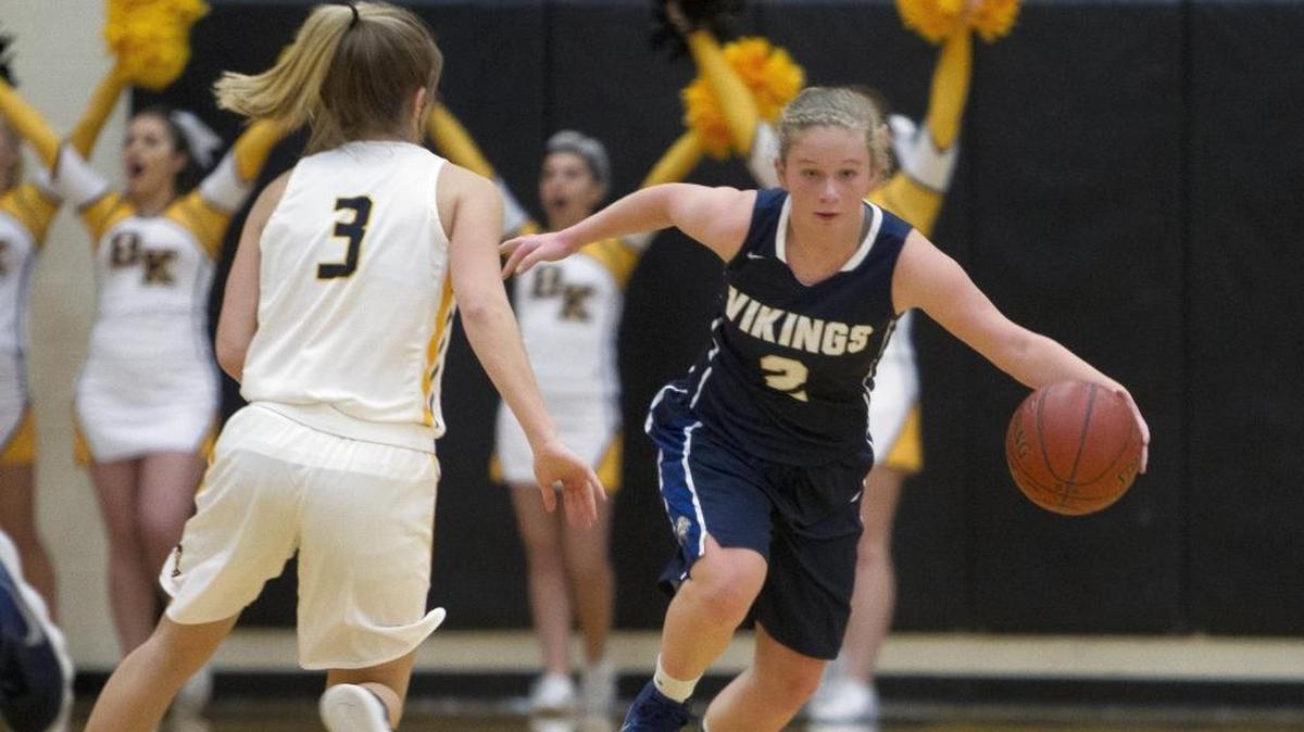 Middleton guard Emmerson Sauer pushes the ball upcourt against by Bishop Kelly’s Olivia Kent in a rematch of last year’s 4A state championship game on Friday at Bishop Kelly High.