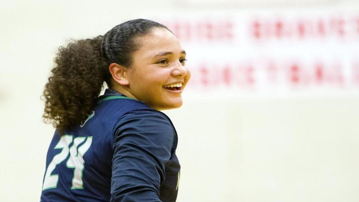 Mountain View guard Destiny Slocum looks back to the Maverick bench and fan section to see friends holding posters heralding her achievement of surpassing 2,000 points Saturday Jan. 16, 2016 at Boise High School. Slocum scored 22 points, one more than she needed, to hit the milestone in her high school career. Mountain View defeated 5A SIC foe Boise 72-46.