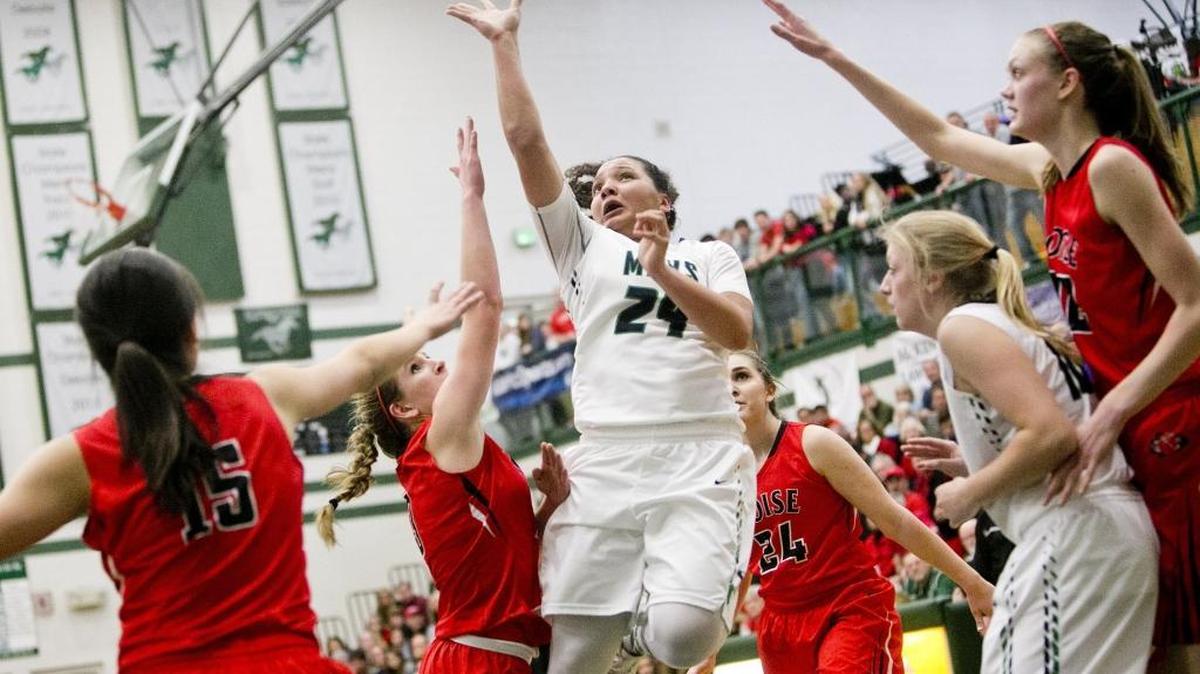 Mountain View’s Destiny Slocum (24) scores over the Boise defense during the 5A District Three Tournament girls basketball semifinals Saturday at Eagle High.