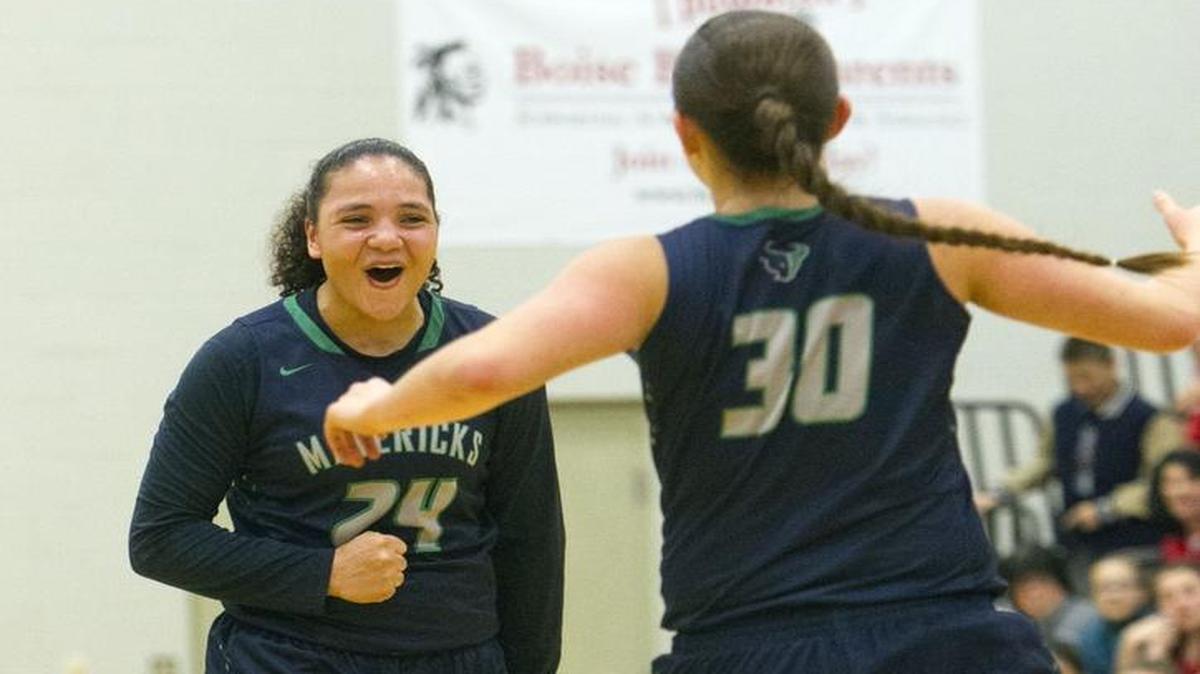 Mountain View’s Destiny Slocum celebrates with teammate Kayla Anderson (30) after an assist in the Mavericks' 72-46 win over Boise on Saturday at Boise High.