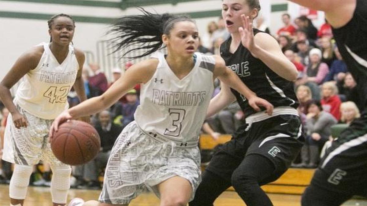 Centennial’s Tori Williams, center, leads the 5A SIC with 20.5 points per game this season.