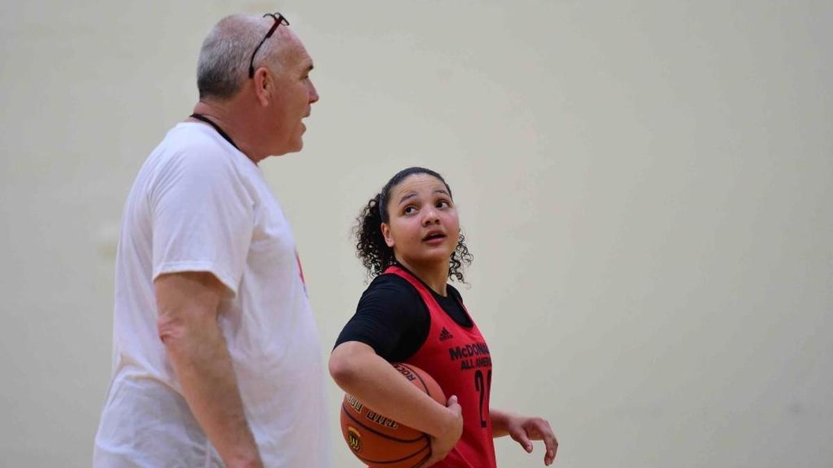 Mountain View point guard Destiny Slocum works with West coach Jessie Nelson of Olpe, Kansas, at a practice in Chicago this week.