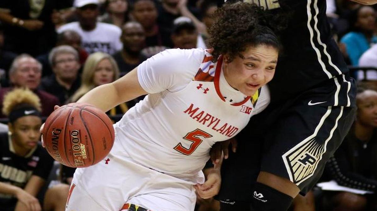 Mountain View grad Destiny Slocum dribbles past Purdue guard Andreona Keys on Sunday during the championship of the Big Ten conference tournament.