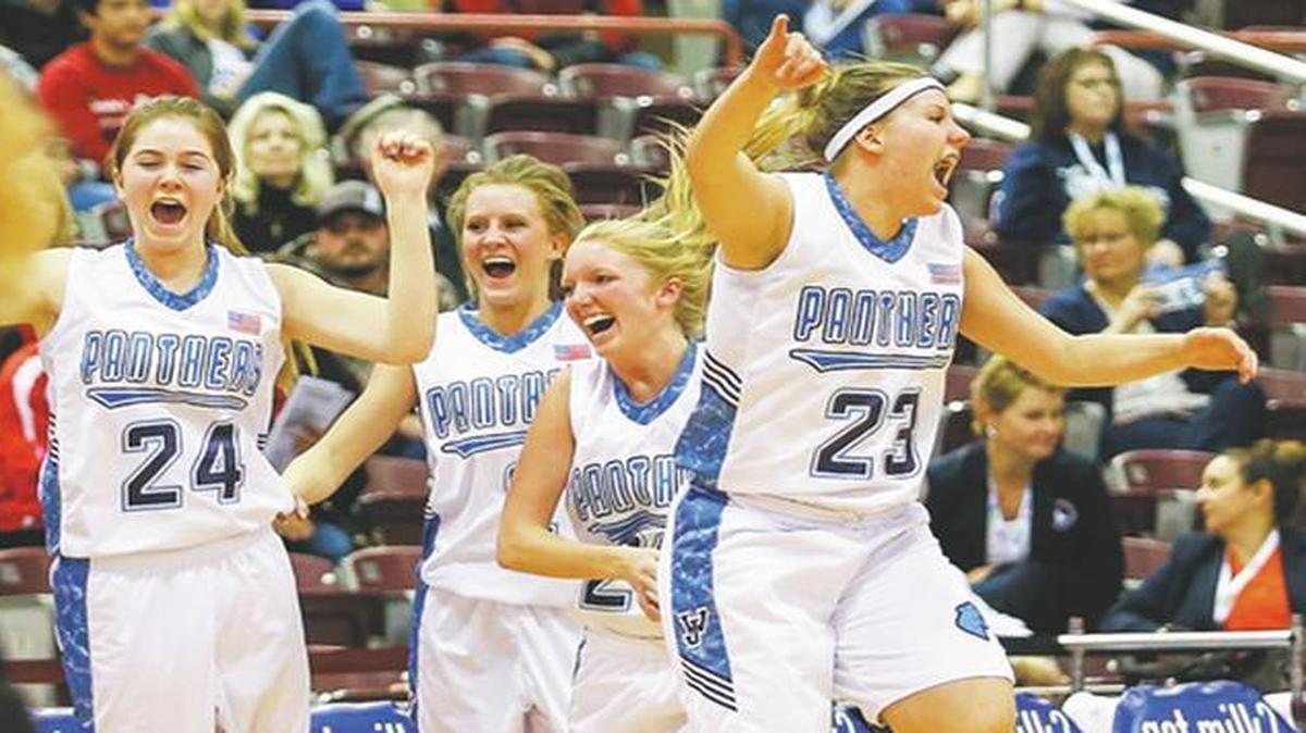 Members of the West Jefferson girls basketball team celebrate their 45-37 victory over Soda Springs in the 2A state championship game.