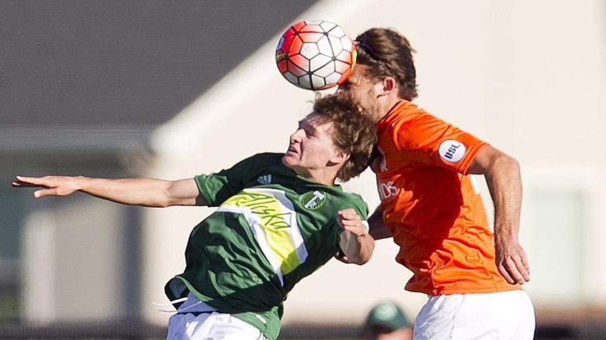 Former Eagle High student Blake Bodily, left, fights for a header with the Portland Timbers 2 against the Swope Park Rangers’ Tommy Meyer during a USL match June 4 at Rocky Mountain High in Meridian.