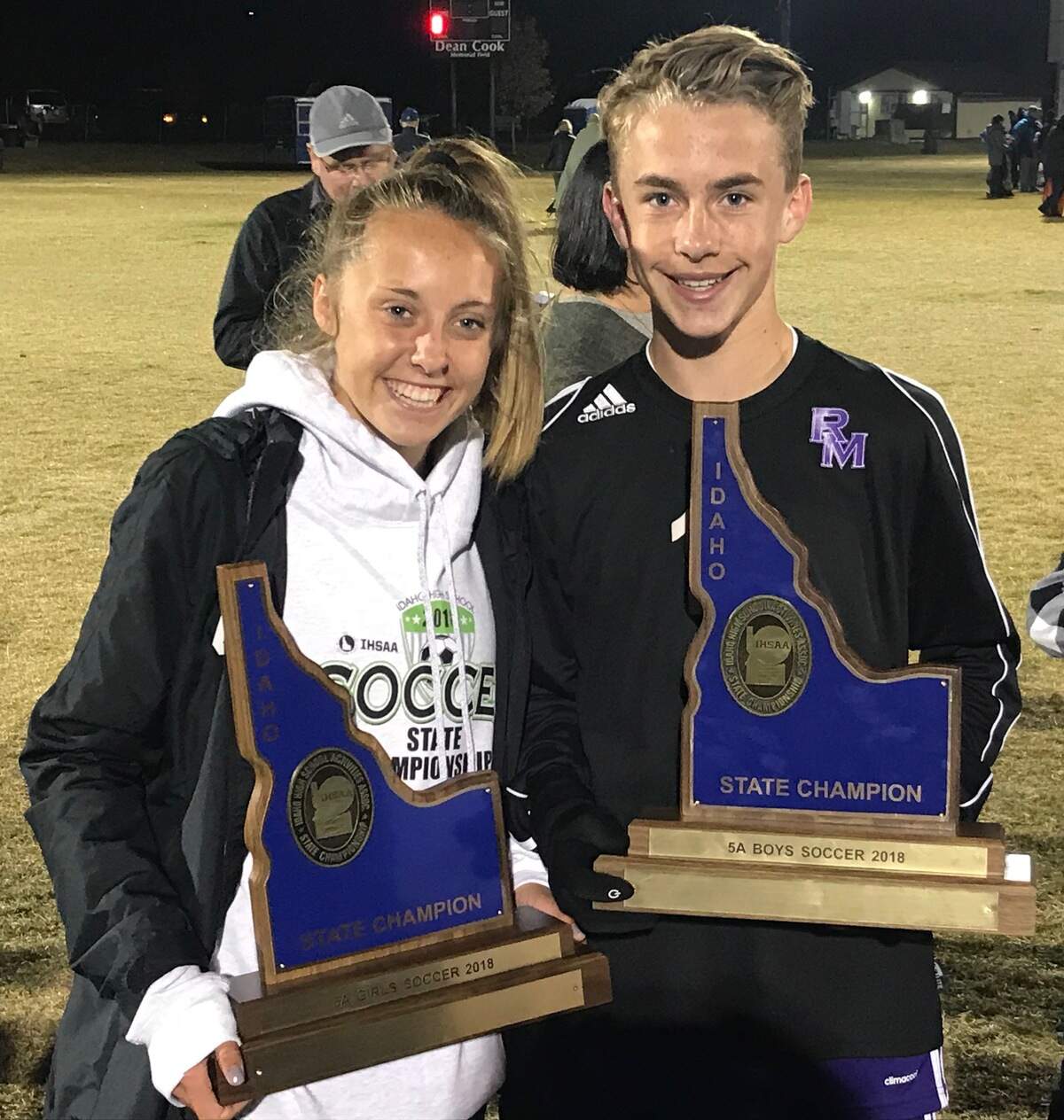 Kelsey and Keegan Oyler pose with the championship trophies in Idaho Falls after helping lead Rocky Mountain to the 5A girls and boys soccer state titles as sophomores in 2018.