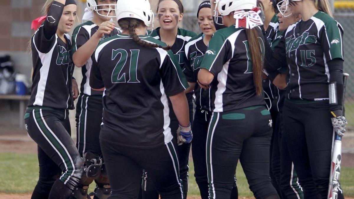 Eagle’s Martha Tooley celebrates her home run as she crosses home plate last season in a win over Vallivue.
