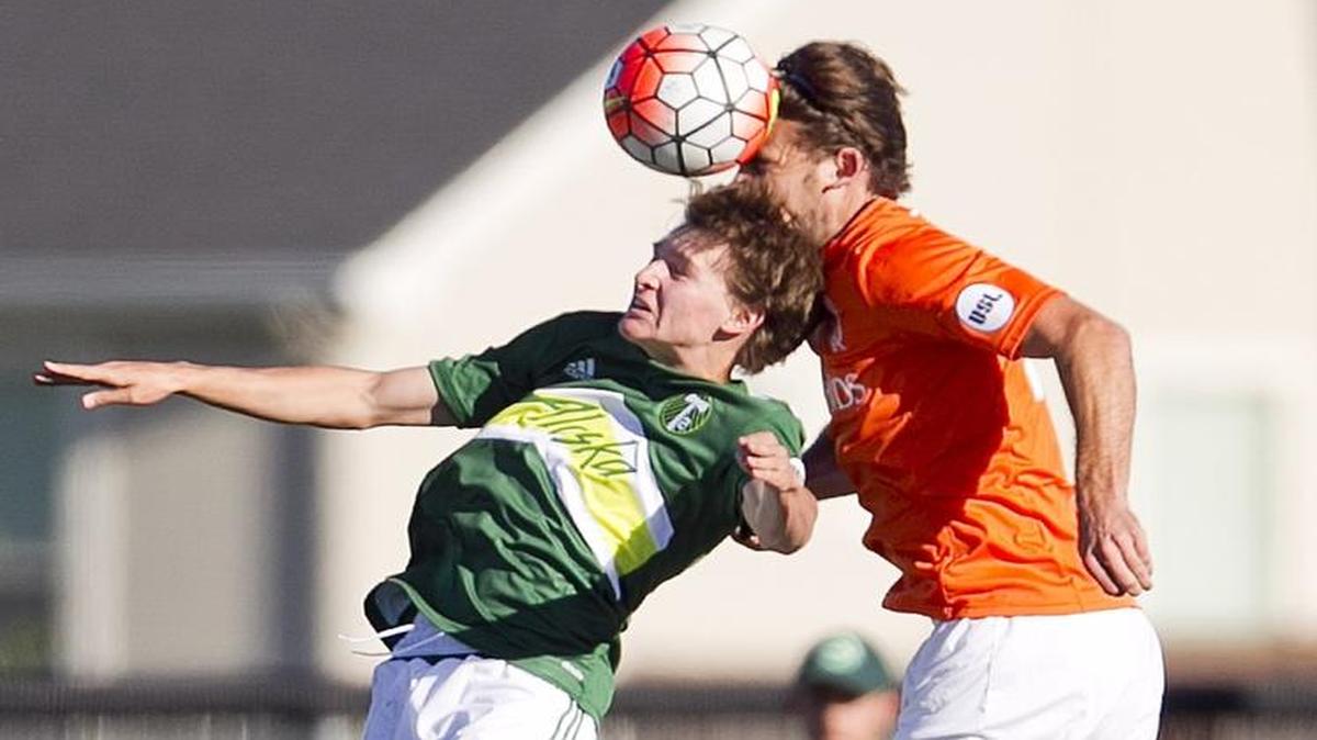 Blake Bodily, left, rises up for a header while playing for the Portland Timbers 2 last summer against the Swope Park Rangers at Meridian’s Rocky Mountain High.
