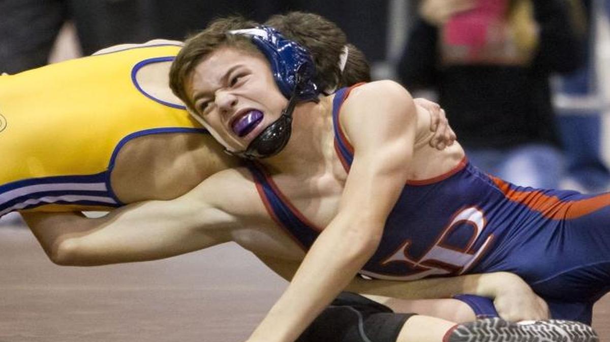 New Plymouth grappler Joe Rice tries to get around Caldwell’s Dante Carreno in the 98-pound championship match of the Rollie Lane Invitational on Jan. 9, 2016 at the Ford Idaho Center in Nampa. Carreno won on a 6-0 decision.