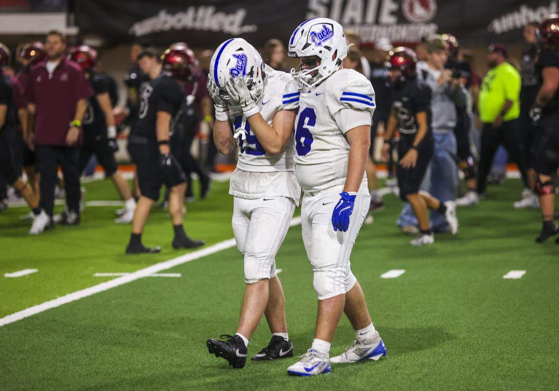 Timberline junior Owen Froehlich, right, comforts junior Evan Anders after losing to Rigby in the 6A state championship game Saturday. 
