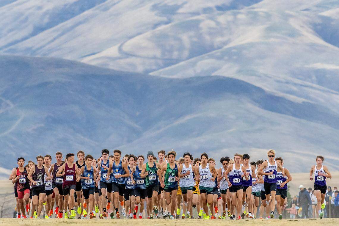 The pack breaks off of the start line during the 6A boys race at the Idaho state cross country meet Saturday at Community Park in the Lewiston Orchards.