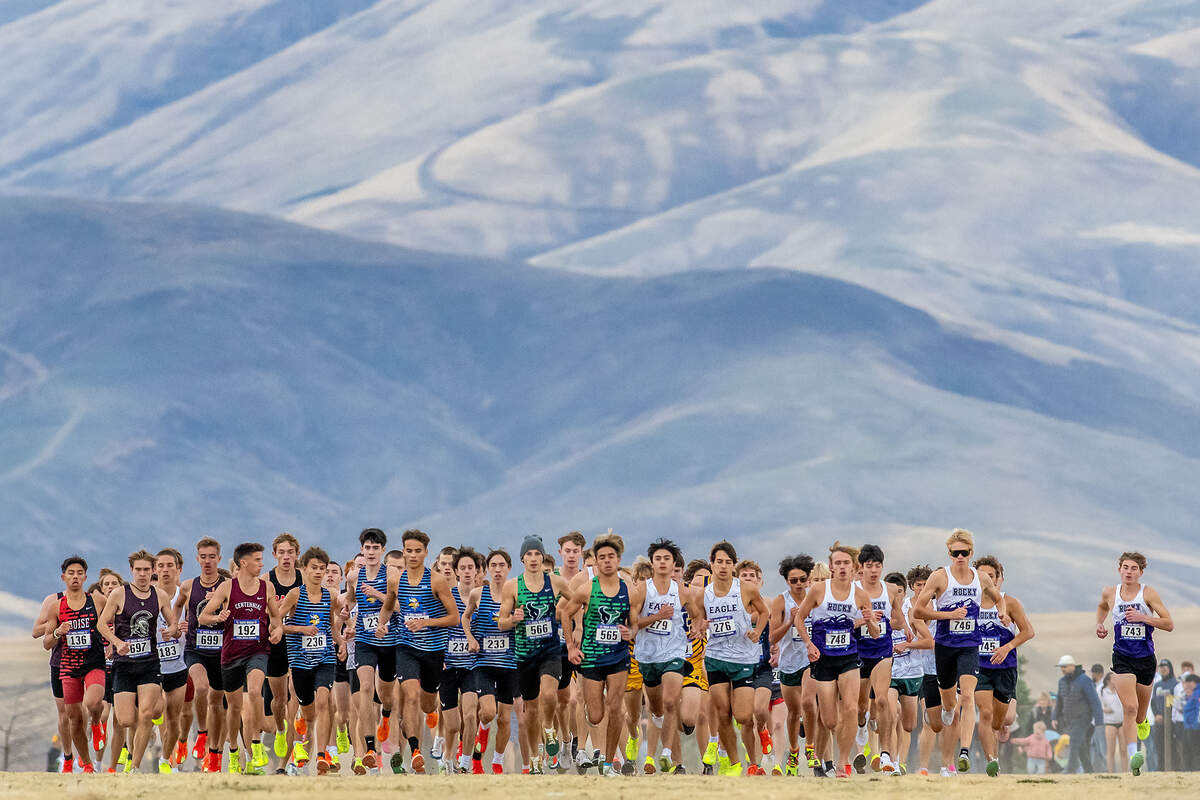 The pack breaks off of the start line during the 6A boys race at the Idaho state cross country meet Saturday at Community Park in the Lewiston Orchards.