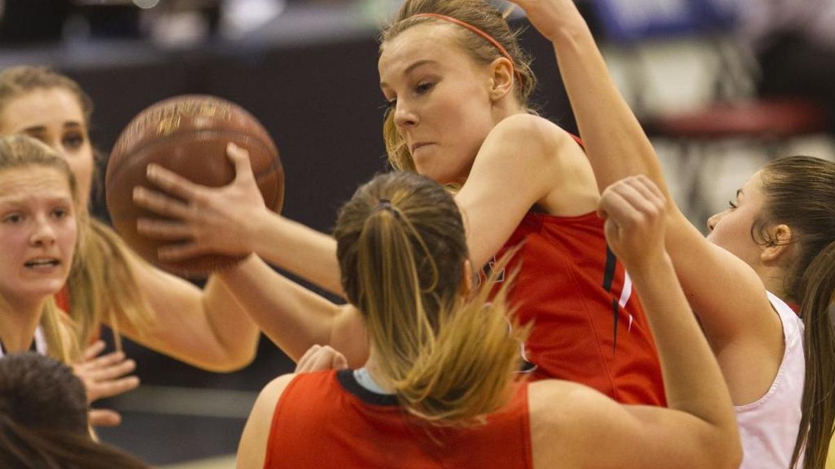 Boise’s Hanna Orton grabs a rebound against Highland in the first round of the 5A state tournament. Orton helped lead the Braves to a state academic championship with a team GPA of 3.942.
