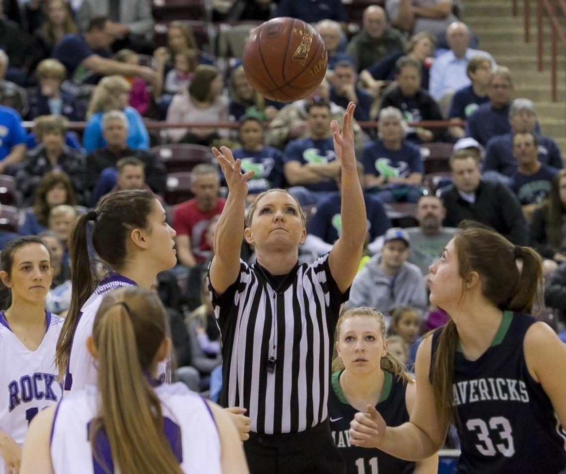 Referee Tobi Cook tosses the jump ball at the start of a 5A girls basketball state semifinal in 2015 at the Ford Idaho Center in Nampa.